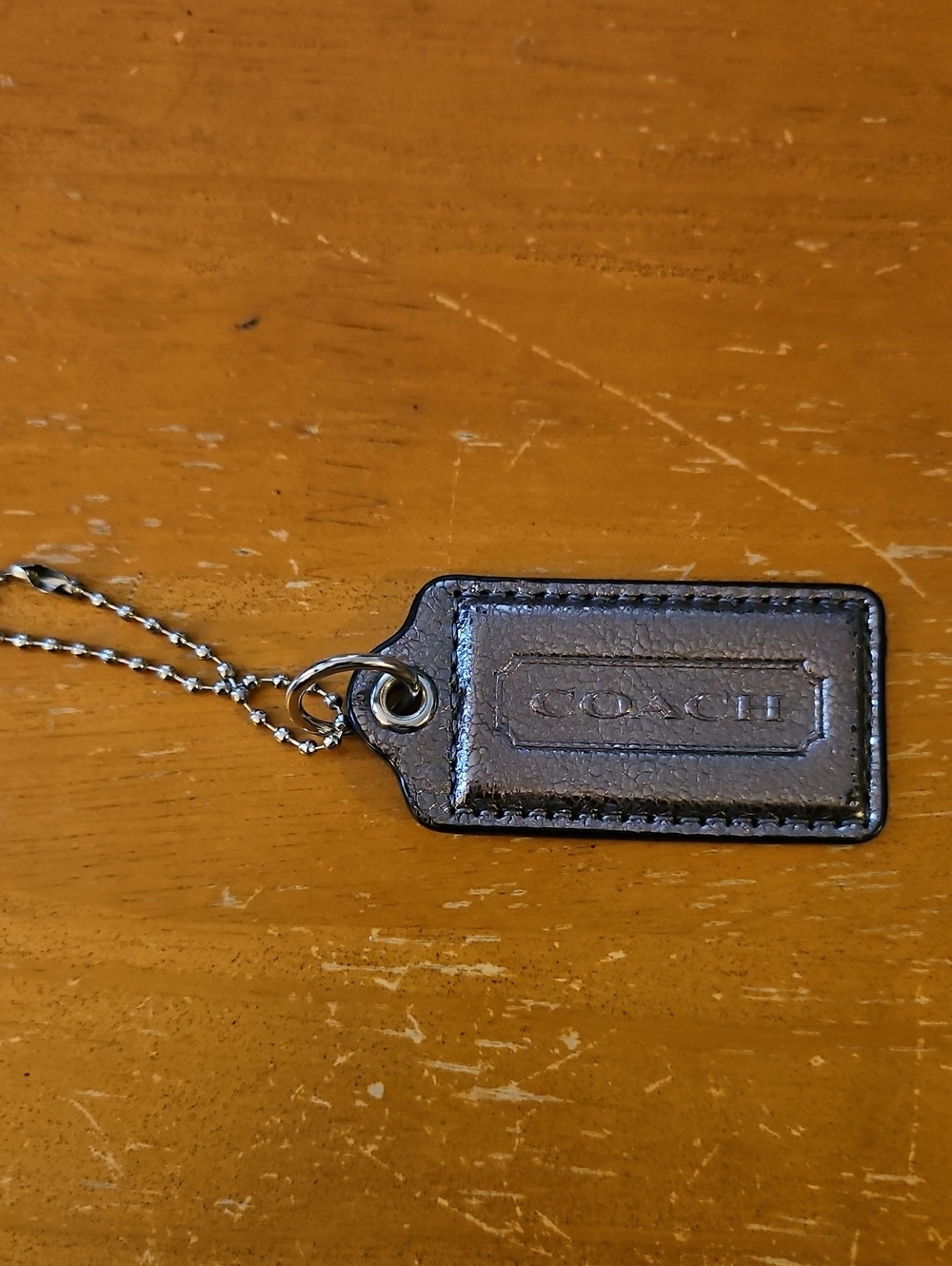 COACH Silver Metallic Leather Hang Tag With Chain